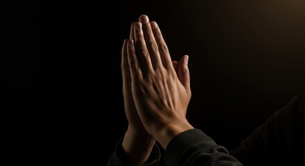 Hands In Prayer Position Against A Black Background For Faith