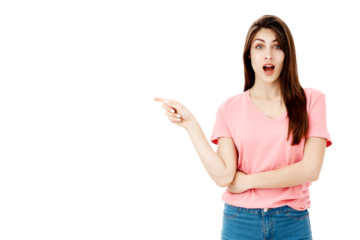 Smiling young woman in casual attire pointing her finger up at copy space