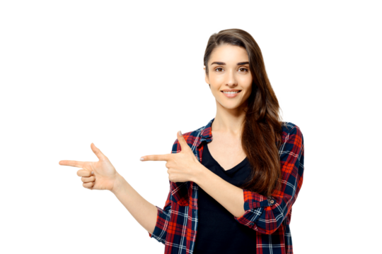 Tender girl dressed in plaid shirt smiling and pointing finger.