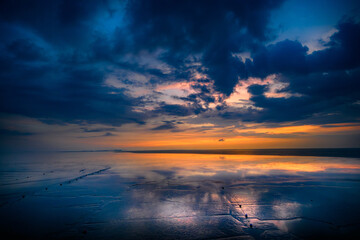 A view of the sea with blue skies and dynamic clouds