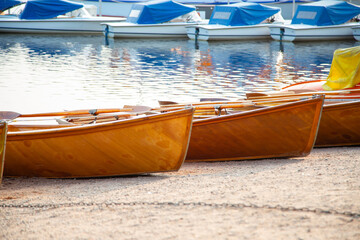 wooden boats on the shore at the lake resort
