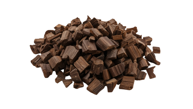 Aromatic agarwood chips in a heap isolated for incense and perfumery with transparent backdrop