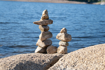 pyramid of stones on the lake coast