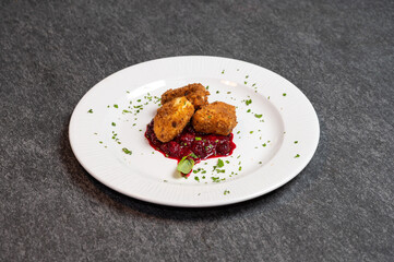 Crispy Fried Camembert Cheese with Sweet Cranberry Sauce on White Plate. Gourmet Appetizer Dish