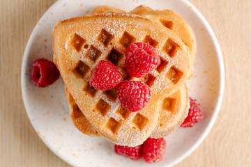 Close-up of waffles with fresh raspberries