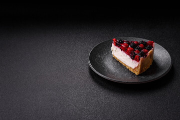 Pie, cheesecake with raspberries and blackberries, mascarpone cheese. Piece of cheesecake