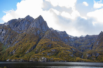 Autumn landscape in Lofoten Islands, Northern Norway, featuring colorful foliage, and a peaceful...