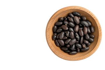 Fototapeta premium A wooden bowl filled with black beans on a white isolate background.