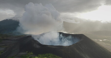 Fiji, Tana Island: Yasur Volcano erupting smoke and ash plumes into the atmosphere, creating a...