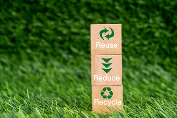 Reuse reduce recycle text and symbol on wood block sustainable concept