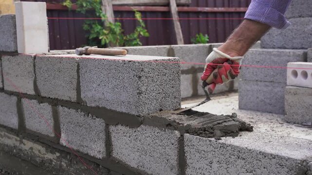 Laying Concrete Cinder Blocks for a Wall Construction
