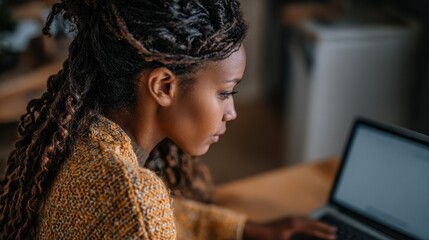African girl school student e learning distance training course study work at home office. Ethnic young woman watching online education webinar using laptop. Over shoulder close up mock up screen vie