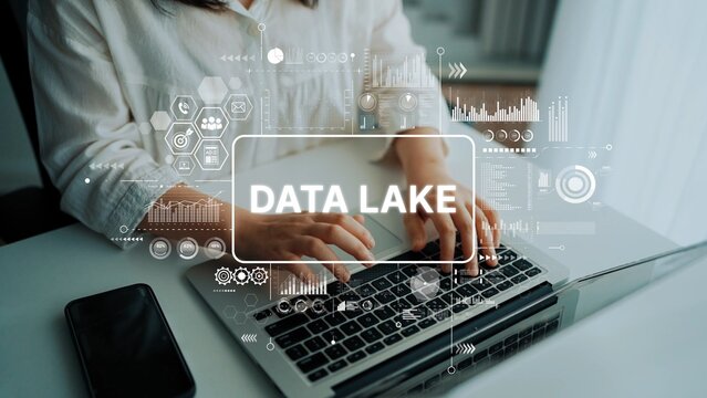 Business Professional Working on Laptop with Data Lake Concept in Modern Office Environment. Asymptotic smart data analytic.