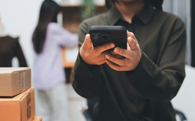 Portrait of Starting small businesses SME owners, two Asian woman check online orders Selling products working with boxs freelance work at home office, sme business online small medium enterprise