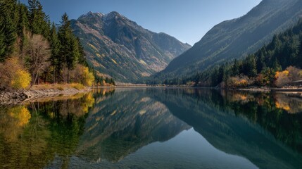 Fototapeta premium Autumn foliage reflected in mountain lake
