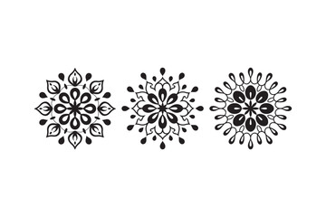 Obraz premium Three symmetrical floral mandala designs in black and white
