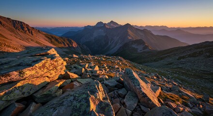 Obraz premium Majestic Mountain Range at Sunrise with Golden Light