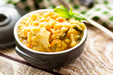 Warm vegetable pea porridge with fresh herbs