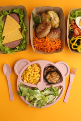 Healthy diet. Different meals in containers and products on yellow background, flat lay. Diet and calorie counting Space for text