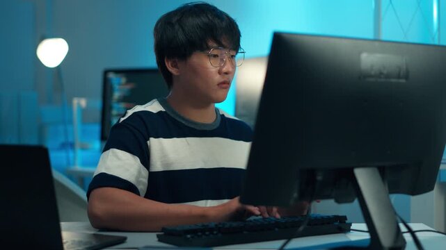 Developer typing code backend programming task software development system engineer technology command data process