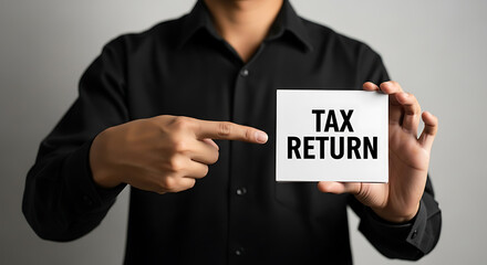 Man points to card announcing tax return preparation