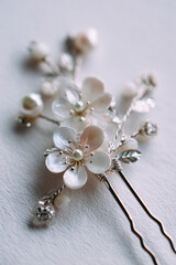 Fototapeta premium Sideview of a silver hairpin with cherry blossom motifs