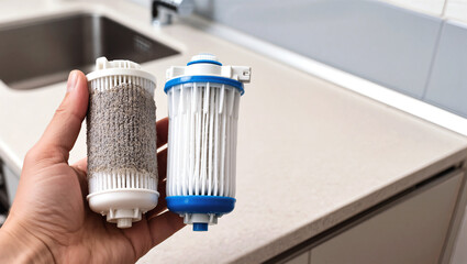 Comparing old and new dishwasher filters held in hand, showing filtration difference. Comparing dishwasher filters demonstrates need for replacement, cleanliness, and improved performance.