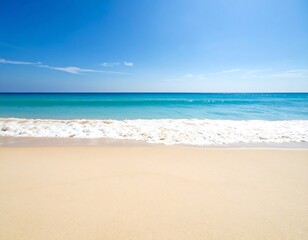 Fototapeta premium Tranquil beach scene under a vibrant blue sky. Vast expanse of light beige sand meets a turquoise ocean, gently lapping waves. Clear, cloud-filled sky