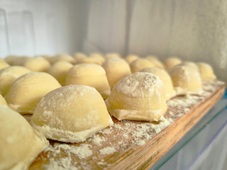 Homemade Dough Balls on Floured Surface Ready for Baking