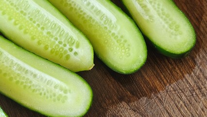 Fresh Cucumber Halves on Wooden Surface – Healthy Food Concept