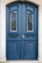 Elegant Blue Double Door with Decorative Glass Panes