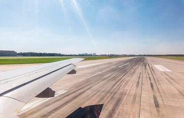 View from the airplane window during takeoff at Sheremetyevo airport at summer