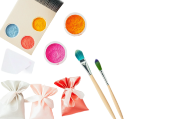 Flat lay of colorful Holi-themed DIY kit with small containers and art tools isolated on transparent background PNG