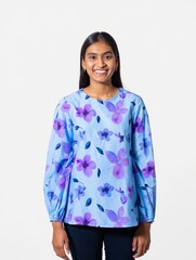 Smiling Woman in Floral Print Top Against White Background