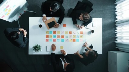 Time lapse of business people brainstorm and share business idea. Top down aerial view of businessman writing marketing strategy on whiteboard while explain plan to executive manager. Directorate. - Powered by Adobe