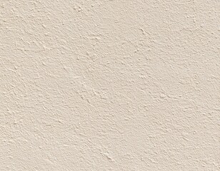 Fototapeta premium Close-up of a light beige textured wall. A smooth, stucco-like surface with subtle, uneven bumps and slight variations in tone
