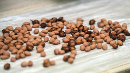 Washed cherry pits drying on a plastic bag for crafting eco-friendly children's toys and sensory play materials