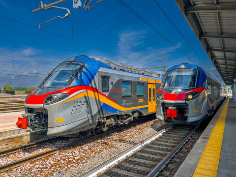 Fossano, Italy - July 23, 2025: two  Regional train Trenitalia Pop ETR 104  the track at railway station
