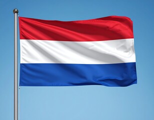 Dutch flag waving against a clear sky