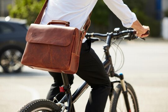 Man Cycling with Leather Messenger Bag - Urban Commute