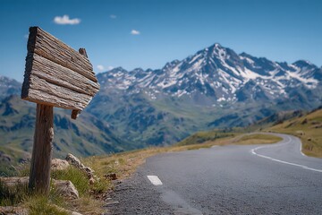 Wooden signpost on dark road in mountain landscape  
