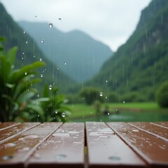 Overhead Shot of Rain Splashing on Wood Table Against Soft Focus Nature Landscape