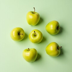 Overhead Shot of Six Vibrant Green Apples in Balanced Composition on White Surface