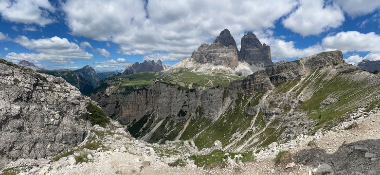 Panoramic View of Tre Cime di Lavaredo &ndash; Iconic Rocky Peaks of the Dolomites Seen from a Mountain Trail, Stunning Landscape under Clear Sky during a Summer Hike in the Italian Alps