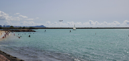 People and Plane at Seaside Beach