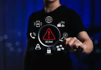 Scam Alert and Cybersecurity Threat Detection Concept. Person holding magnifying glass with scam...