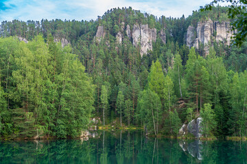 Adrspach, Czech Republic - 20.07.2025: View of the Adrspach-Teplice Rocks with Lake Piskovna. Forest and rocks.