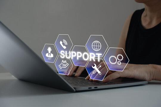 Customer service and technical support concept. Woman using laptop with support icons, online technical assistance, technology information, call center, help desk and 24/7 help solutions in business.