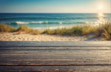 Fototapeta premium Wooden table with blurred beach scene and golden sunlight.