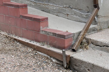 Downspout modified to reach alleyway.